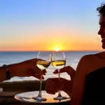 Couple enjoying wine with ocean view